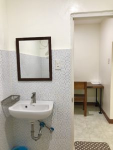 Wash basin and mirror inside Seaview room.